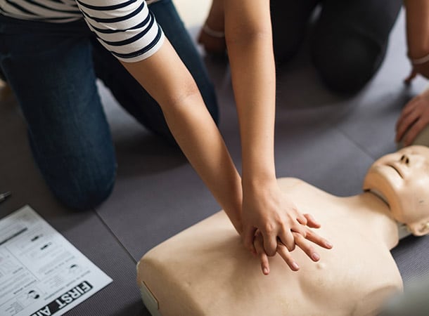 Practising CPR on a mannikin